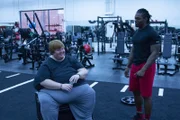 Casey smiling with Dex in conversation.