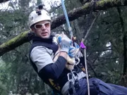 Using a stuffed cat, Shaun Sears demonstrates the proper way to hold a cat during a rescue.