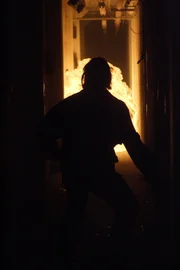 Members of the Branch Davidians try to escape the flames