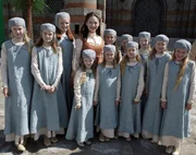 Tenar, Kristin Kreuk surrounded by the young novices outside the Temple of Atuan.