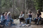 Rain, Ami, Billy, Bird, Bear, and Bam Brown around the family campfire.