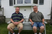 Randy and Gary sit together.