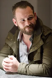 Tim Kelly (Ty Olsson)