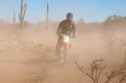 Nogales, AZ: An agent on a motorcycle in the desert. Customs and Border Protection agents use many different vehicles while on duty. These vehicles can be used on both patrol and on a criminal pursuit.