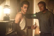 David and Koresh and fellow member hear something.