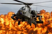 An AH-64D Apache "shows its muscles" at an air show. An AH-64D Apache "shows its muscles" at an air show.