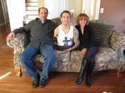 Nick Santonastasso sits with his parents Stacey Santonastasso and Mike Santonastasso.