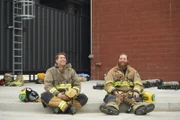 Tory and Tommy sit in their trainee uniform