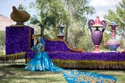 Andrada next to the wedding float in her wedding dress.