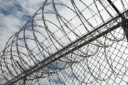 El Paso, TX: A close up of the barbed wire fence that lines the border.