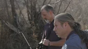 Brian Barczyk and Chewy searching for snakes.