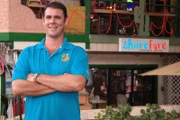 Shore Fyre's owner standing in front of his restaurant in Honolulu.