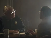 An officer interrogating a suspect.