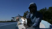 Thad Robinson holding a Tarpon he caught in Mexico.