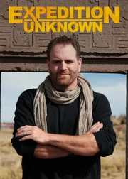 Josh Gates in front of the Gate of the Sun.