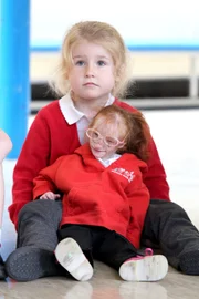 Picture Shows: Charlotte Garside is the World's Smallest Girl and has primordial dwarfism Charlotte Garside in her new school (Easington Primary School) in Easingotn near hull. Charlotte is enjoying school life as she sings, play games and takes part in craft activities with her school mates.