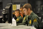 Nogales, Arizona, USA: Border Patrol agents watch surveillance cameras from headquarters to monitor the border of Nogales.