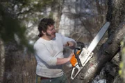 Gabe clears land for his new cabin site.