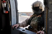 SAN DIEGO, CA, USA: An Air and Marine border patrol agent prepares to board his blackhawk plane. The agent is one of thousands working to protect the San Diego-Tijuana border, one of the largest crossing areas, from illegal smuggling.