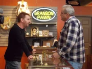 Scott talking to a customer in the shop.