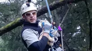 Using a stuffed cat, Shaun Sears demonstrates the proper way to hold a cat during a rescue.