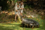 Zookeepers Stuart Gudgeon, Toby Millyard, Harrison Varley with Bosco the crocodile.