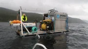 Telemark, Norway - Thor Olav Sperre (l.) and Anders Ree Kirkevold are seen on the survey barge positioned out in the middle of Lake Tinnsjo. Far below the ROV will allow them to get a close up view of the wreck of the SF Hydro.