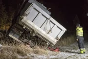 Odda, Norway - Picture of the truck from behind. Olav Eike (one of Thords employees) is watching and planning how to get the truck up. 
 (National Geographic)