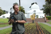 Josh Gates searches for a treasure from the book The Secret in Golden Gate Park of San Francisco, California.