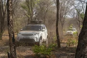 Land Rover going through forest