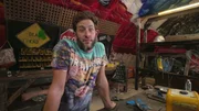 Beau Boruff stands behind workbench