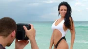 In Miami, PAOLA MAYFIELD poses during her beach photo shoot with ALLEN GRIGSBY.