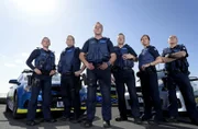 MELBOURNE - AUSTRALIA 7TH OCTOBER 2015 - Police Members from Highway Patrol pose for portraits in Frankston on 7th of October 2015 in Melbourne, Australia.