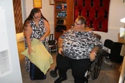 Rena helping Lee pack to go to the hospital.