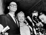 A undated picture shows US actress Marilyn Monroe (C) and her husband US playwright Arthur Miller (L). Monroe's unpublished writings will be published in France and in around ten countries next October, according to French publishing house Le Seuil on August 5, 2010.