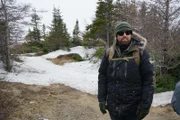 Forrest Galante stands on trail in search for Newfoundland Wolf.