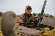 man hunting goose