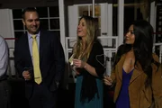 The couple listens to the planner.