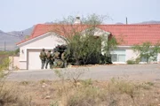 Nogales, Arizona, USA: Agents prepare to bust a suspected "stash house." These customs and border protection agents prevent drugs and illegal immigrants from entering the United States.