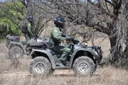 Nogales, Arizona, USA: Border Patrol agents on ATVs through the rugged terrain.