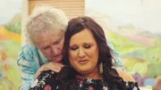 Leslie is comforted by her grandmother, Shirley, at her 80th birthday in Wisconsin.