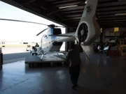 McAllen, TX, USA: U.S. Customs and Border Protection Air and Marine Unit helicopter being transported out of hangar. (Photo Credit: NGT)