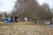 Children from Utoya Island run for their lives to a departing ferry.