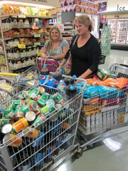 Gia and her mom with their haul before checkout.