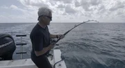 Jeremy Wade fishing for a reef shark off the coast of Bimini, Bahamas.