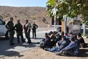 SAN DIEGO, CA, USA: Border patrol agents apprehend a large group of illegal immigrants who attempted to cross the San Diego-Tijuana boundary hidden in a commercial vehicle. This San Ysidro border crossing is the busiest in the world, with over 40 million people entering the U.S. through the port in 2005 alone.