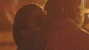 Regina and Ray kiss.