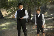 On left: Man in Black (Ed Harris), on right: Little Boy (Oliver Bell).