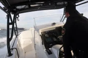 SAN DIEGO, CA, USA: Border patrol agents conduct a "fast boat drill" on the water near the San Diego-Tijuana border. In 2009, with heightened land enforcement fueling human smuggling by sea, the border patrol introduced this fast, 43-foot boat for pursuit of high-speed vehicles.