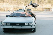 The guys check out the Delorean.